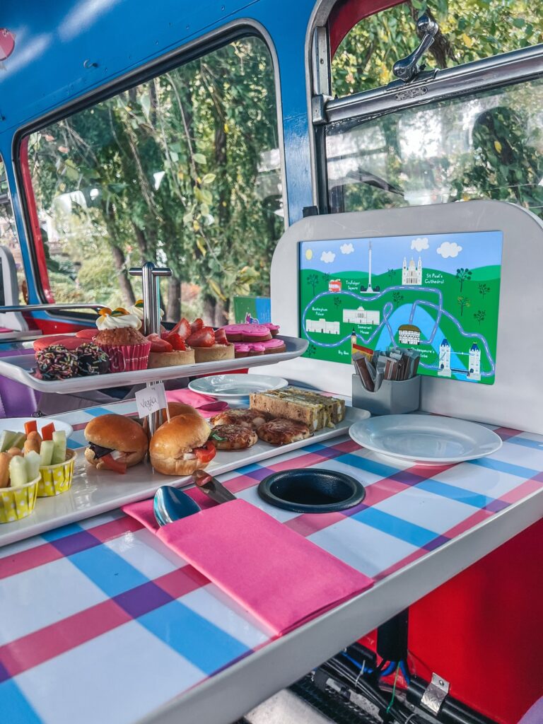 Peppa Pig bus tour route screen on the table next to the afternoon tea stand