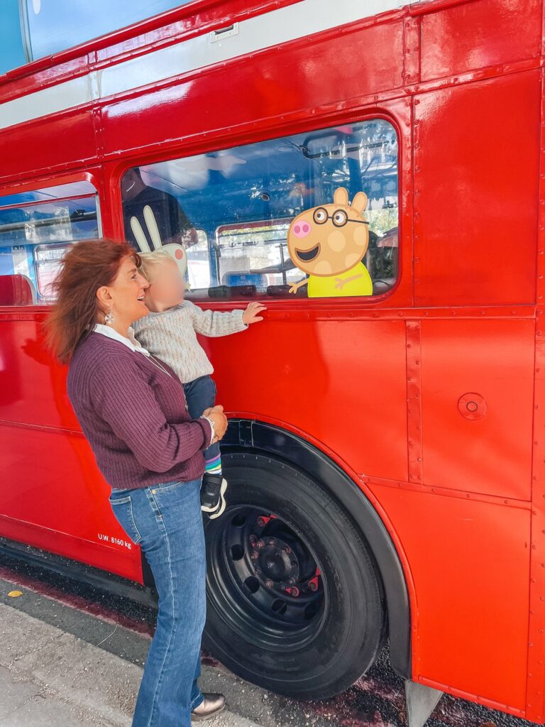 Peppa Pig Afternoon Tea Bus Tour in London, the red double decker bus with Peppa Pig characters in the windows