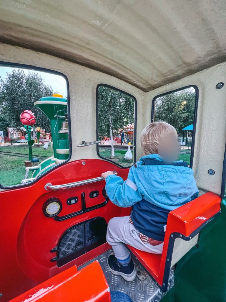 Toddler riding the Margate Express miniature train at Dreamland Margate