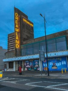 Dreamland Margate neon sign on the art deco entrance building at dusk