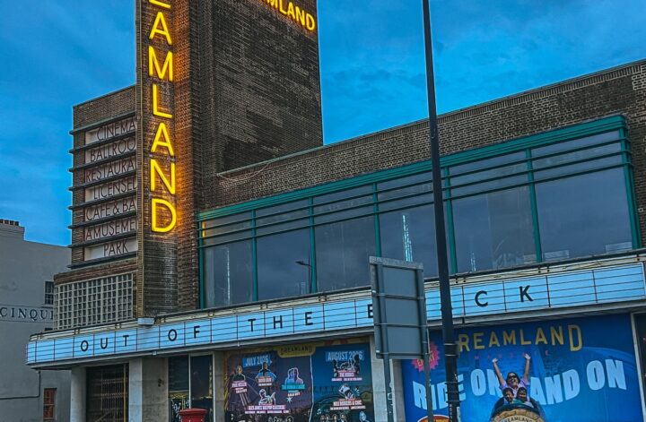 Dreamland Margate neon sign on the art deco entrance building at dusk