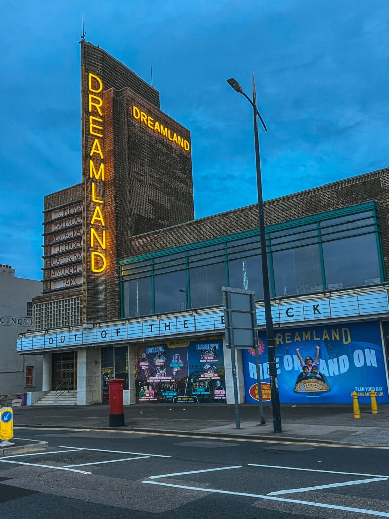 Dreamland Margate neon sign on the art deco entrance building at dusk