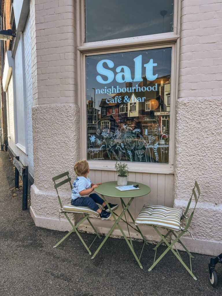 Toddler at a table outside Salt neighbourhood café and bar in Broadstairs